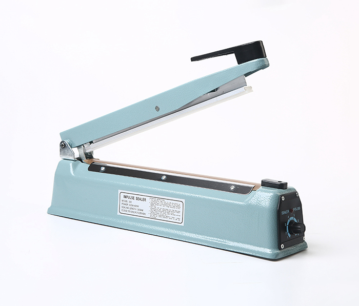 300 - two flattened iron shell hand pressure sealing machine